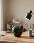 Helvano | Schwarze Katzenkopf-Skulptur mit hypnotischen Augen