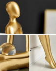 Helvano | Abstrakte Skulptur aus Metall in Gold