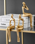 Helvano | Abstrakte Skulptur aus Metall in Gold